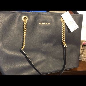 MK pocket book alittle worn at the bottom